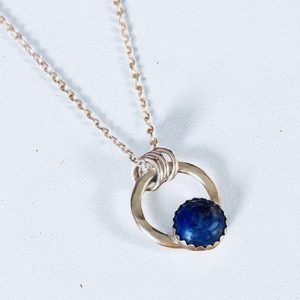 Lapis lazuli hammered silver circle necklace.